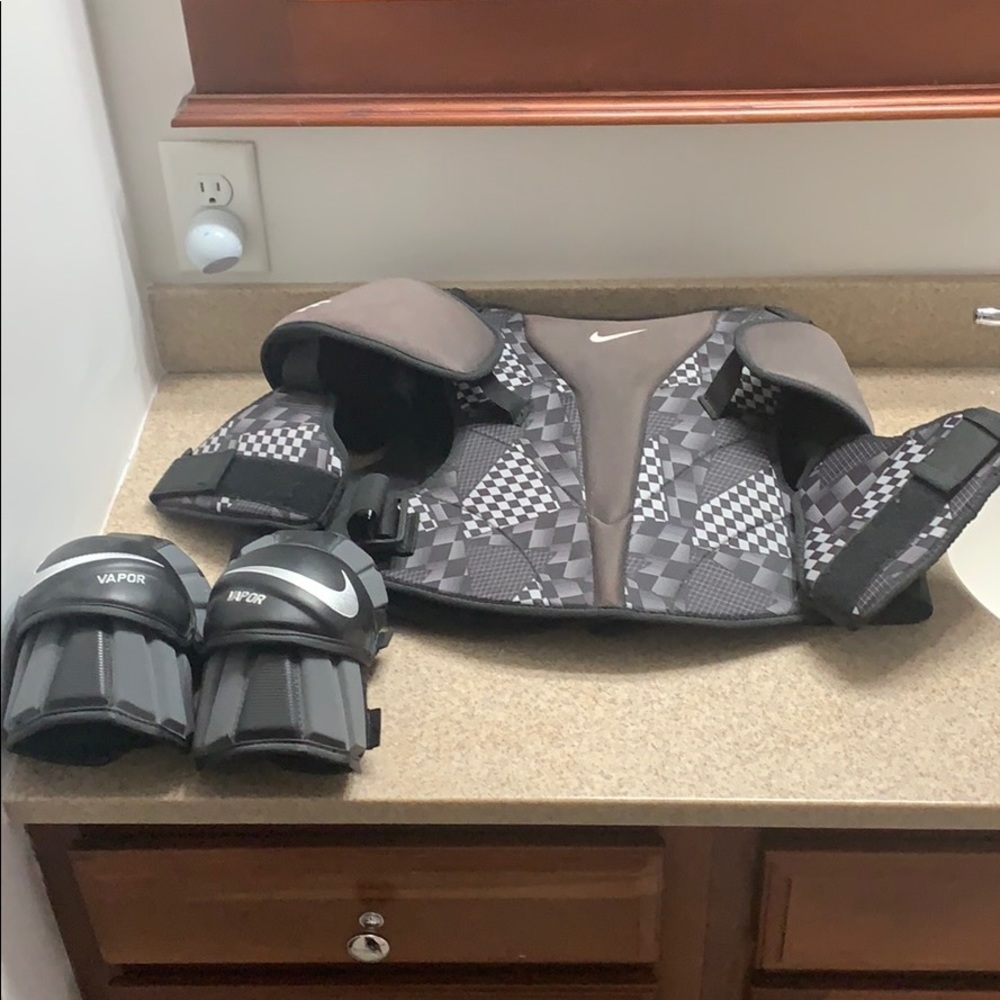 Nike black lacrosse pads with elbow pads
